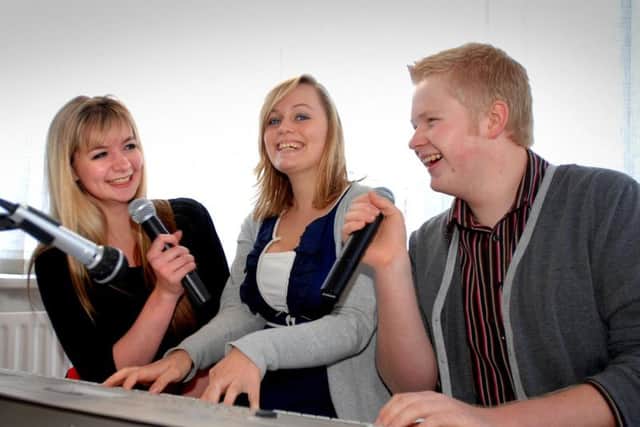 Flashback to 2008 - Christian Lunn practising with fellow local singers Maddie Olley and Polly Sands for a fundraising concert for the Harrogate Young Carers charity.