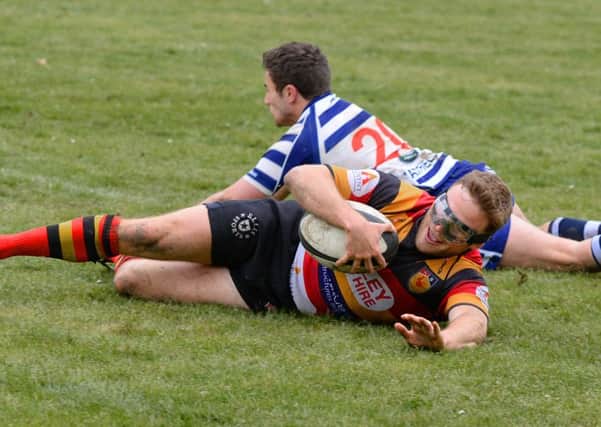 Danny Matthews goes over for a try during Harrogate RUFC's home success over Pocklington. Picture: Richard Bown