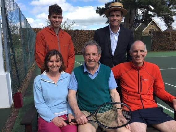 Paying tribute to the late Mary Brown at Birstwith Tennis Club - Back, from left - grandson Stuart Walker and son Peter Brown. Front, from left - daughter Rachel Walker, chairman of Birstwith Tennis Club Sir James Aykroyd and son Harvey Brown.