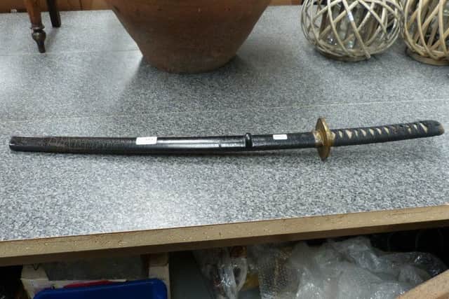 This Samurai sword with a shagreen handle realised Â£320.