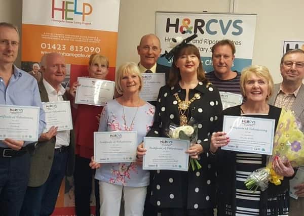 Volunteers Rod Macauley, second left, and Pat Jones, second right, received their certificates from the Mayor of Harrogate Coun Anne Jones.