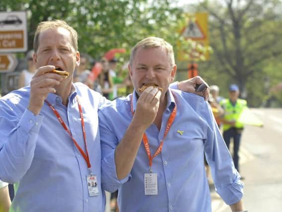 The chief executive of Welcome to Yorkshire Sir Gary Verity tucks into pizza on Tour de Yorkshire Day in Pateley Bridge with Christian Prudhomme, the chief of ASO, who organise the Tour de France. Picture by Adrian Murray. (1805061AM28)