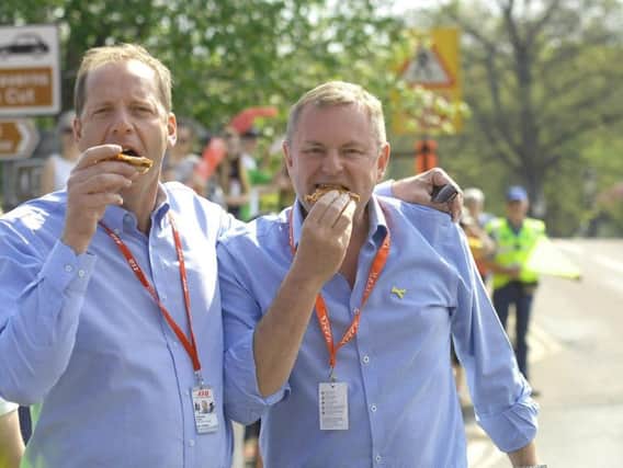 The chief executive of Welcome to Yorkshire Sir Gary Verity tucks into pizza on Tour de Yorkshire Day in Pateley Bridge with Christian Prudhomme, the chief of ASO, who organise the Tour de France.  Picture by Adrian Murray.  (1805061AM28)