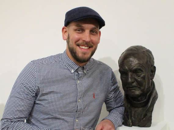 Pateley Bridge sculptor Joseph Hayton with the sculpture which won a top award at Pall Mall Gallery in London.