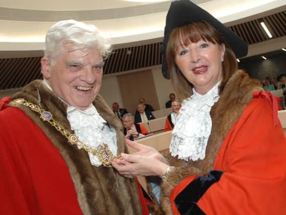 Outgoing Harrogate mayor Coun Anne Jones presents new mayor  Coun Bernard Bateman with the chains of office.  (1805215AM3)