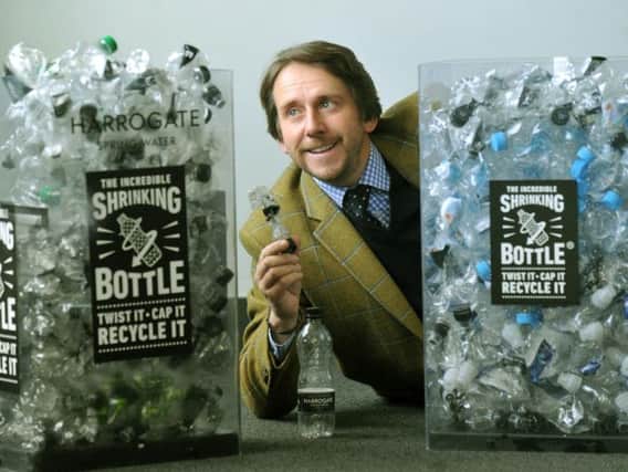 James Cain, managing director of Harrogate Spring Water, alongside their shrinking bottles making it easier to recycle.